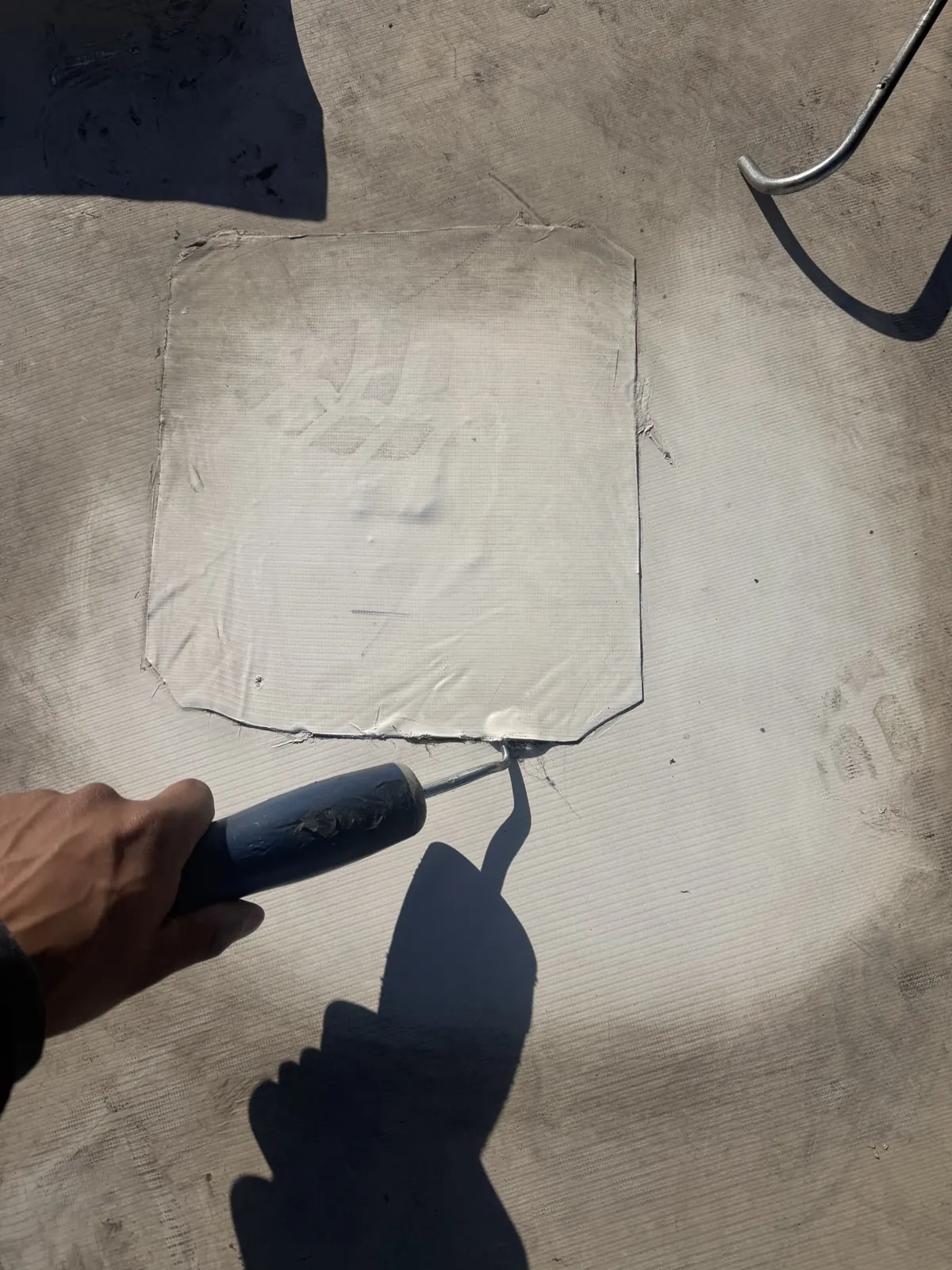 CCM Roofing crew applying preventative roof membrane treatment