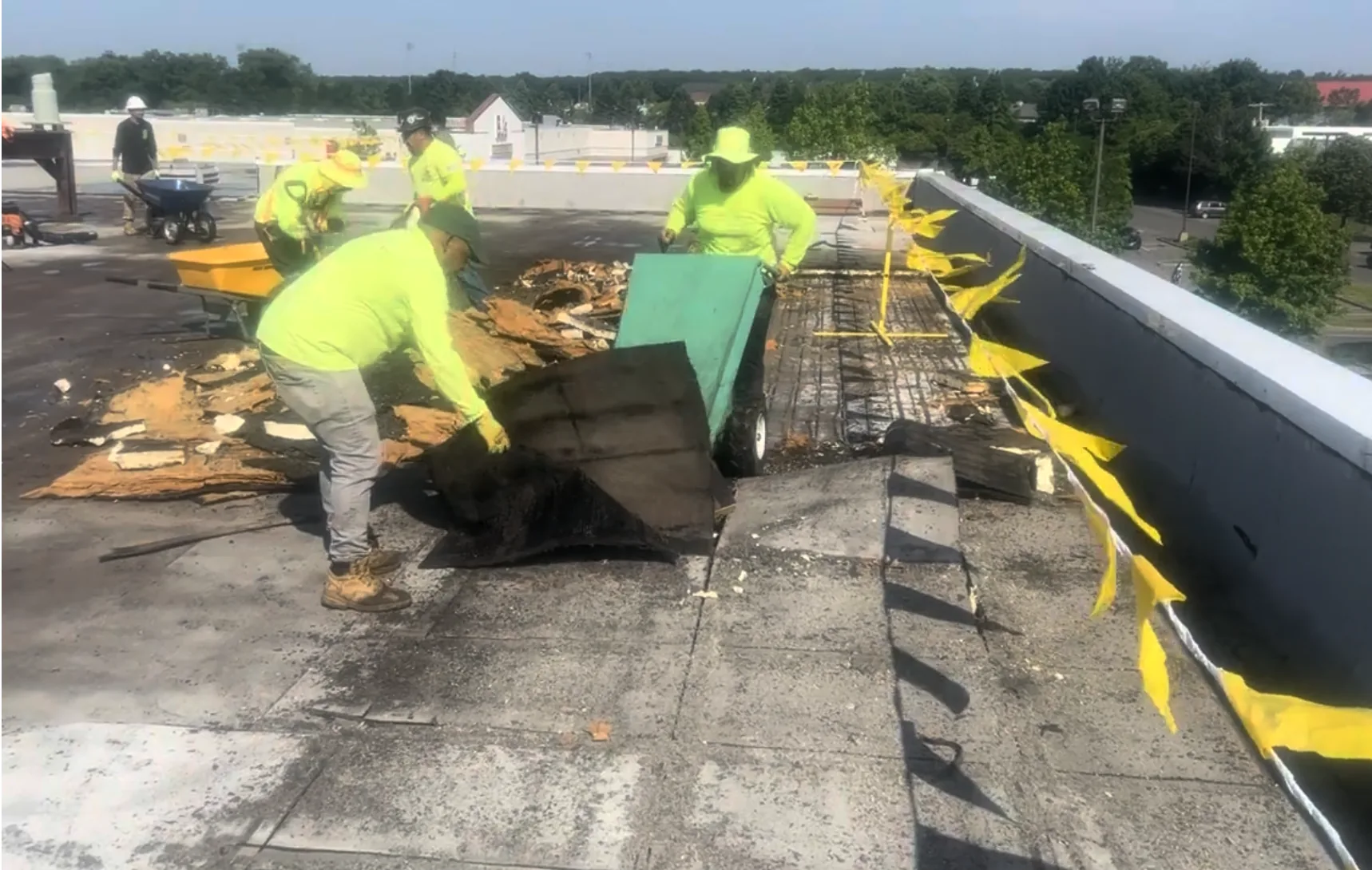 CCM Roofing crew performing complete roof removal