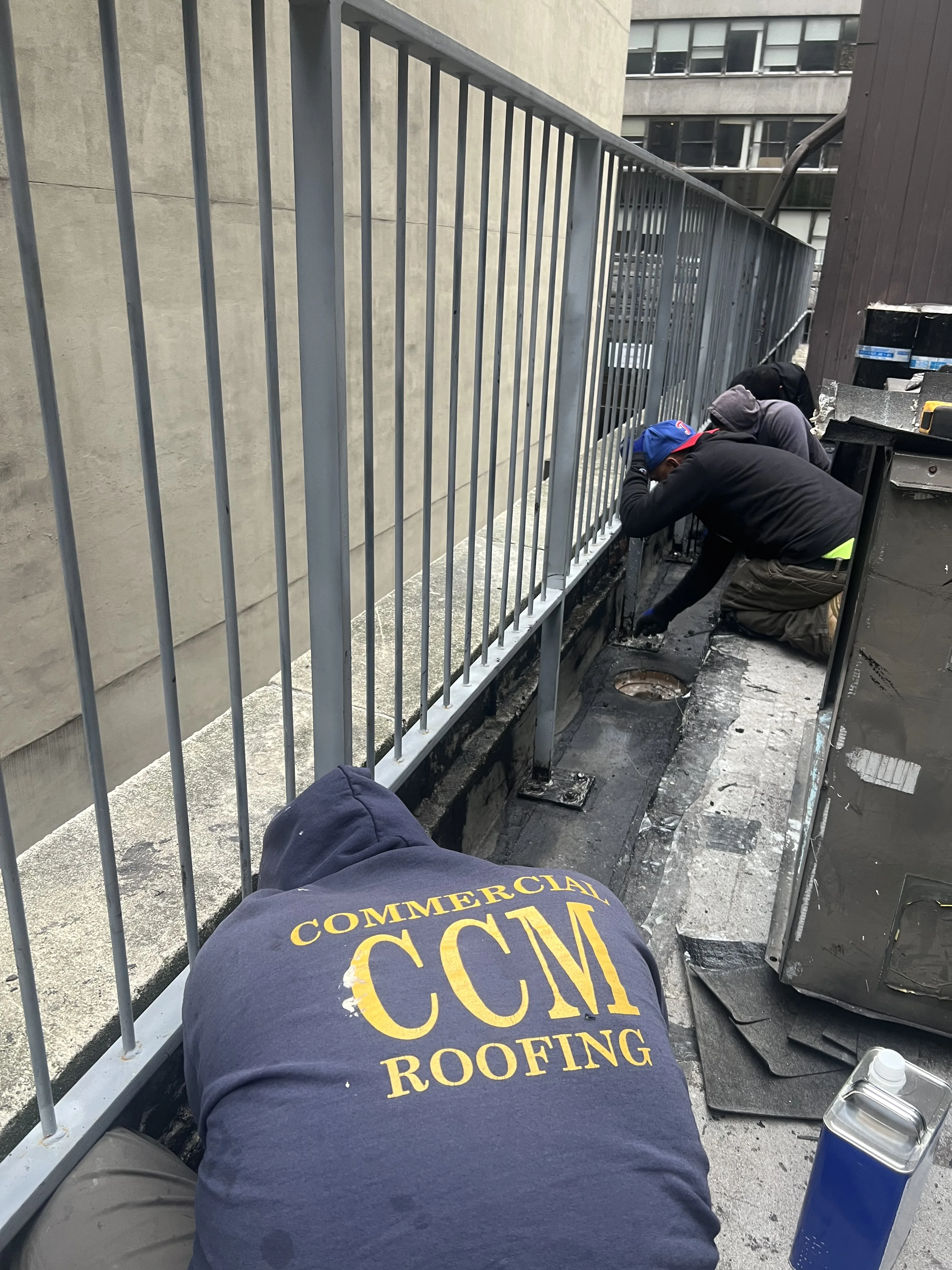 CCM Roofing crew at work on a Manhattan rooftop